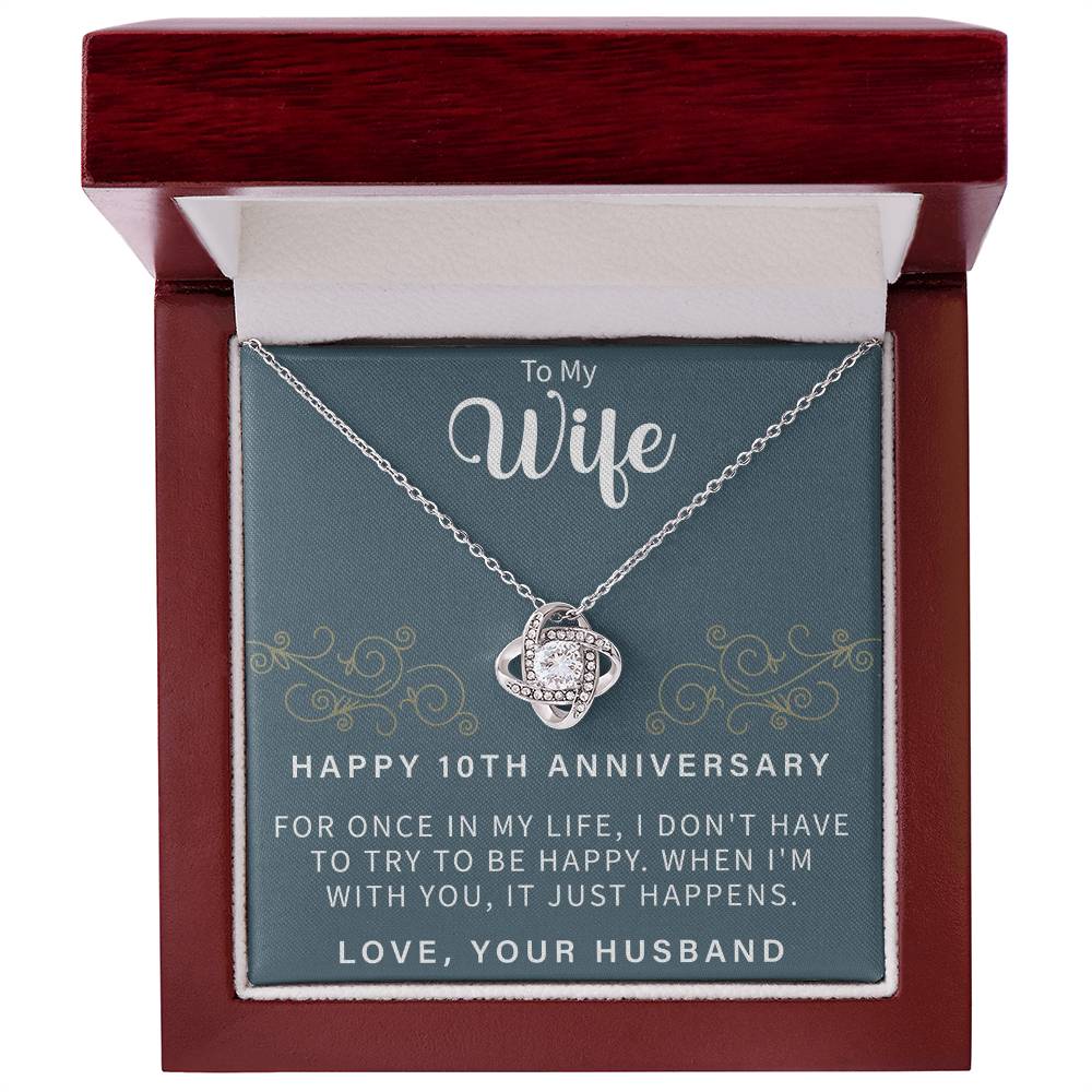 close up of a sparkling love knot necklace symbolizing a decade of love