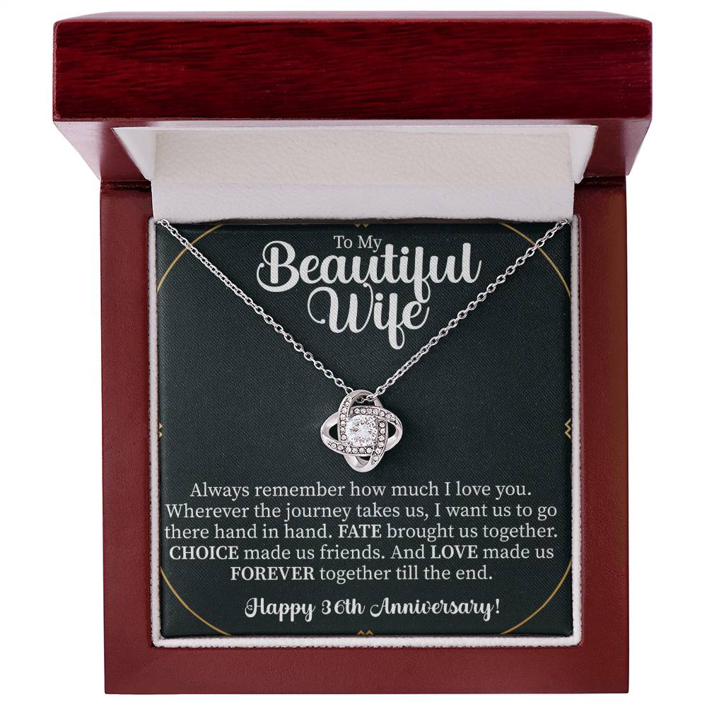 close up of a sparkling love knot necklace symbolizing a lasting 36 year marriage
