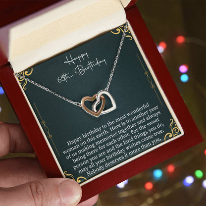 65th birthday necklace displayed with a heartfelt message card