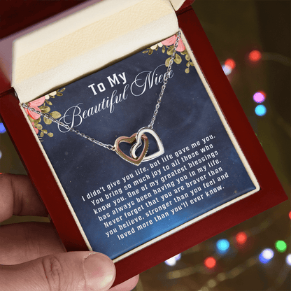 interlocking hearts necklace displayed with a motivational message card from aunt