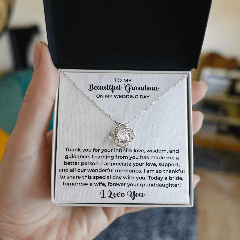 close up of a delicate pendant necklace gifted to grandma with a loving message