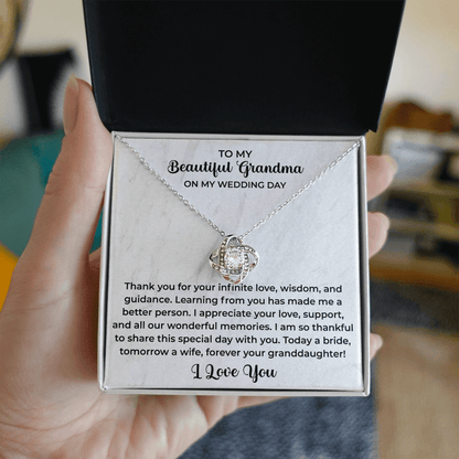 close up of a delicate pendant necklace gifted to grandma with a loving message