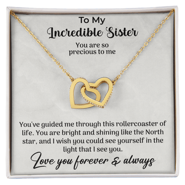 close up of interlocking hearts necklace designed as a meaningful gift for sister