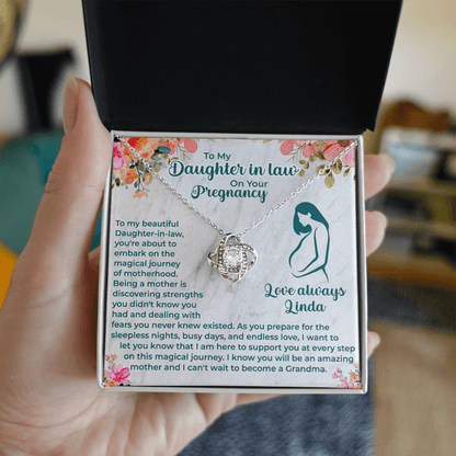 close up of love knot necklace designed as a meaningful gift for expecting daughter-in-law