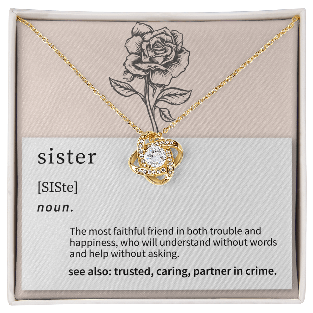 close up of a delicate love knot pendant chosen as a meaningful gift for a sister
