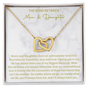 close up of a charm necklace celebrating the special connection of mother and daughter