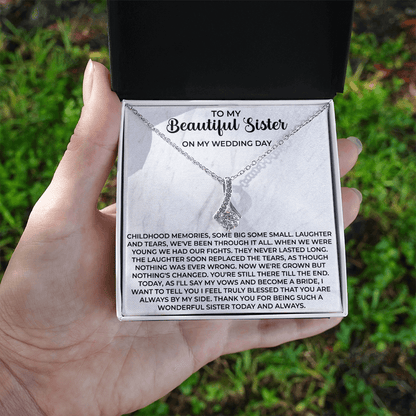 close up of a delicate pendant necklace chosen as a heartfelt gift for sister