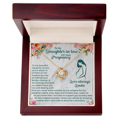 pregnancy necklace displayed with a heartfelt message card for daughter-in-law