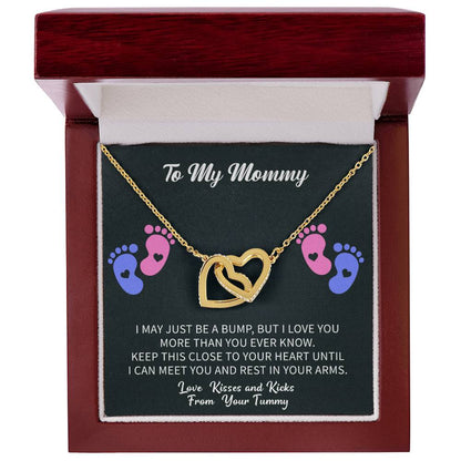 emotional gifting moment showing a Giftsignature necklace given to a mommy to be