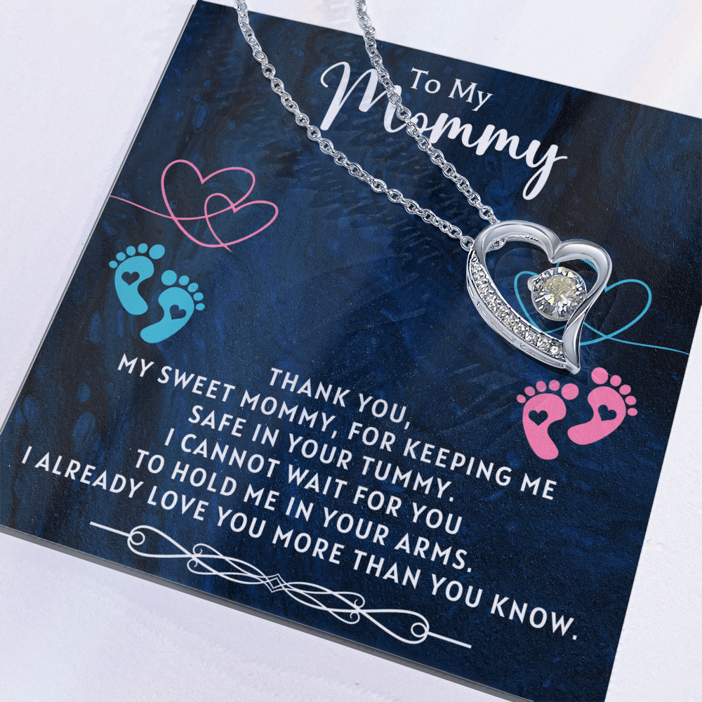 close up detail of necklace designed for pregnant mom